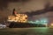 Moored oil tanker at night with dramatic clouds, Port of Antwerp, Belgium