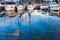 Moored sailboats on a pier calm early morning