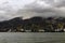 Moored for unloading / loading sea ships against the background of mountains in the clouds.