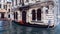 Moored venetian gondola on water canal in Venice