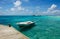 Moored white boat in blue Maldivian lagoon