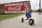 MOORESVILLE, NC-May 19, 2018: Coca Cola Mural Livery Building Radio Flyer Stoller