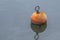 Mooring Buoy Reflecting on Calm Water