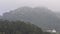 Moorish castle and the tower of the Sintra National Palace with heavy fog in Sintra, Portugal