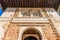 Moorish Islamic Arch above a wooden door in Granada, Spain, Euro