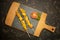 Moorish skewers on black stone and wooden cutting board with tomato slices