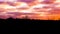 Moorland landscape at sunset with nacreous clouds, a rare winter weather effect