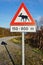 Moose crossing road sign