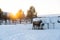 Moose standing near hays in a snowy field in the north of Sweden