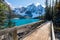 Moraine lake in autumn sunny day. Snow-capped mountains. Banff National Park, Alberta, Canada.