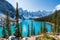 Moraine lake in autumn sunny day. Snow-capped mountains. Banff National Park, Alberta, Canada.