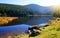 Moraine lake Kleiner Arbersee with mount Grosser Arber in National park Bavarian forest.