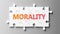 Morality complex like a puzzle - pictured as word Morality on a puzzle pieces to show that Morality can be difficult and needs