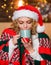 More coffee. happy new year. Christmas. Cheerful woman feel cosy.. Time to celebrate. girl santa hat milk cup. xmas mood