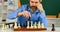 More than only chess. bearded man training for chess competition. chess figures on wooden board. Focused school teacher