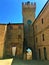 Moresco town in Fermo province, Marche region, Italy. Medieval tower, clock, white curtain and arch