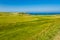 MORFA NEFYN â€“ JUNE 3: Golf course putting green with golfers,