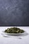 Moringa or drumstick leaves dish, tempered vegetarian dish on a table top