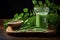 Moringa leaves extract in a glass on wooden background.