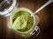 Moringa powder on a spoon, close up