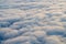 Morning accumulation of cumulus clouds passing slightly diagonally right, aerial photography at altitude of ten thousand kilometer