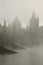 Morning autumn foggy Prague gothic Charles Bridge with Old Town, Czech Republic
