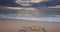 Morning on the beach shore, text 2024 happy new year on the sand and scenic sea sunrise