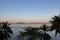 Morning on beach with trees and boats. Sunrise in Palawan island, Philippines. Tropical isles in morning dusk.