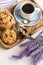 morning breakfast. A cup of coffee, cookies with chocolate . bouquet of lavender. butterfly on a flower