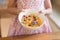 Morning breakfast, little girl hand holding cornflakes cereal, s