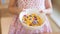 Morning breakfast, little girl hand holding cornflakes cereal, s