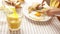 Morning breakfast scene: a boy cuts eggs while his parent pours him juice