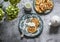 Morning breakfast table - apples pancakes with sour cream, teapot, bouquet of hydrangeas on a gray background, top view