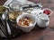 Morning breakfast table - greek yogurt with homemade granola on a dark background