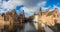 Morning Bruges, Belgium. Panoramic Image In Realistic Color with Rozenhoedkaai in Brugge,Dijver river canal with Belfort / Belfry