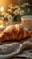 Morning charm Breakfast table with croissant, cup, and bokeh background