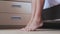 Morning, close-up female feet walk on tiptoes in bedroom. Sensual barefoot lady with nice pedicure moving delicately.