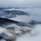 Morning clouds in mountain valley view from above