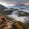 Morning clouds in mountain valley view from above