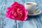 Morning coffee and beautiful pink peony flower