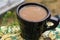 Morning Coffee in Nature. Mug, Herbal Drink Benefits , Wild Flowers, Rural Western Still Life, Herbalism Outdoor, Milk, Rustic.