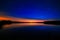 Morning dawn on starry background sky reflected in the water o