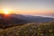 Morning Dawn Sunlight of Bright Golden Sunrise with Yellow Flowers Green Hills and Colorful Sky