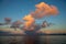 Morning dew sky with orange cloud and moon. Seaside sunrise photo with moon and clouds. Orange sunset or sunrise