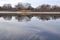 Morning at the Dnieper river with reflactions on still water surface