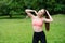 Morning exercise with fit girl secluded with nature in a summer meadow outdoors.