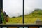 Morning fog and meadow in the window view