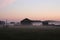 Morning fog over the residential village at dawn around the houses