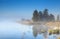 Morning fog over wild lake