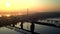 Morning fog on the river at sunrise. Foggy landscape with railway bridge